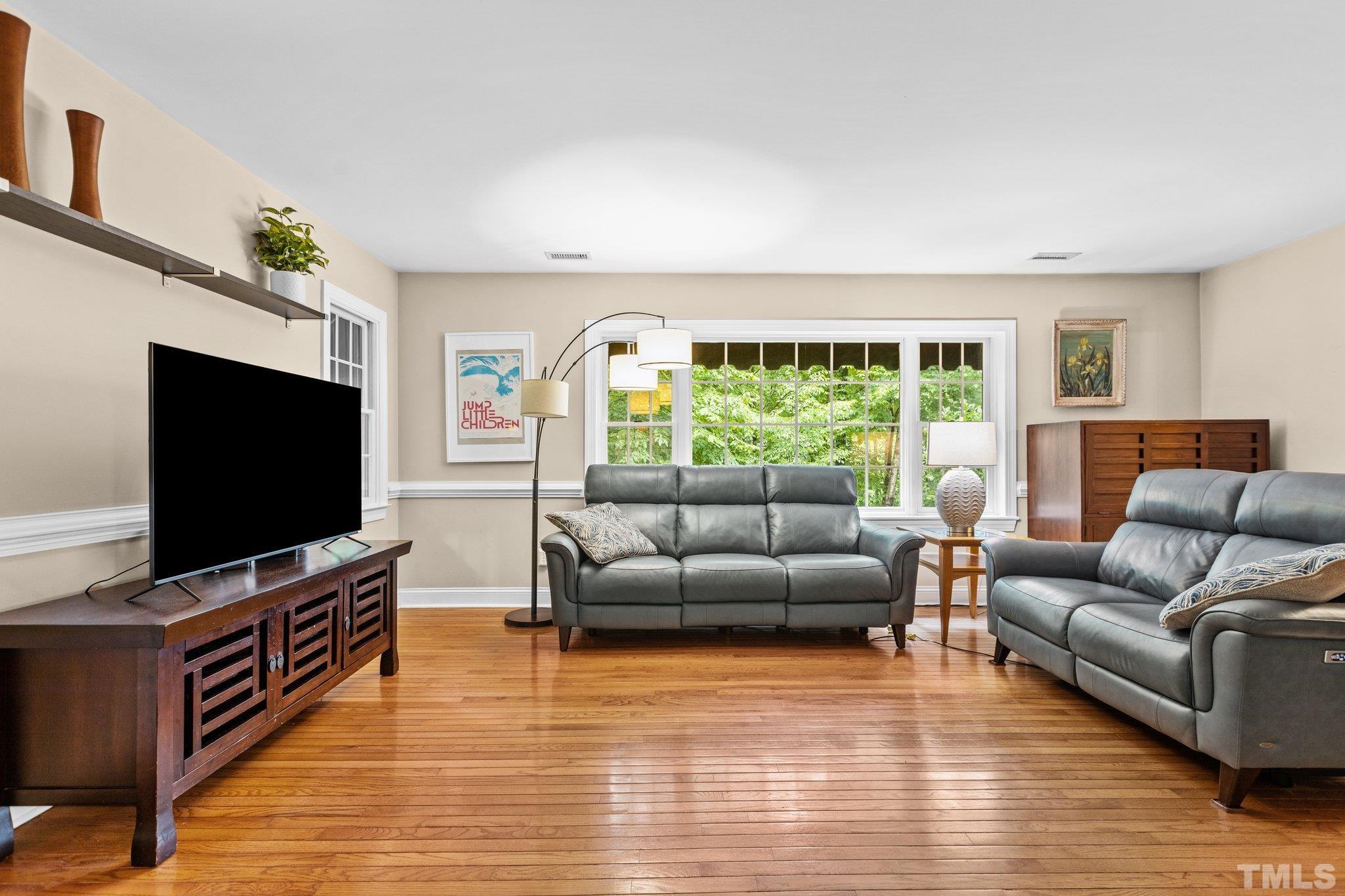 108 Rhododendron Court Chapel Hill, NC 27517 - Photo 3 of 38 a living room with furniture and a flat screen tv