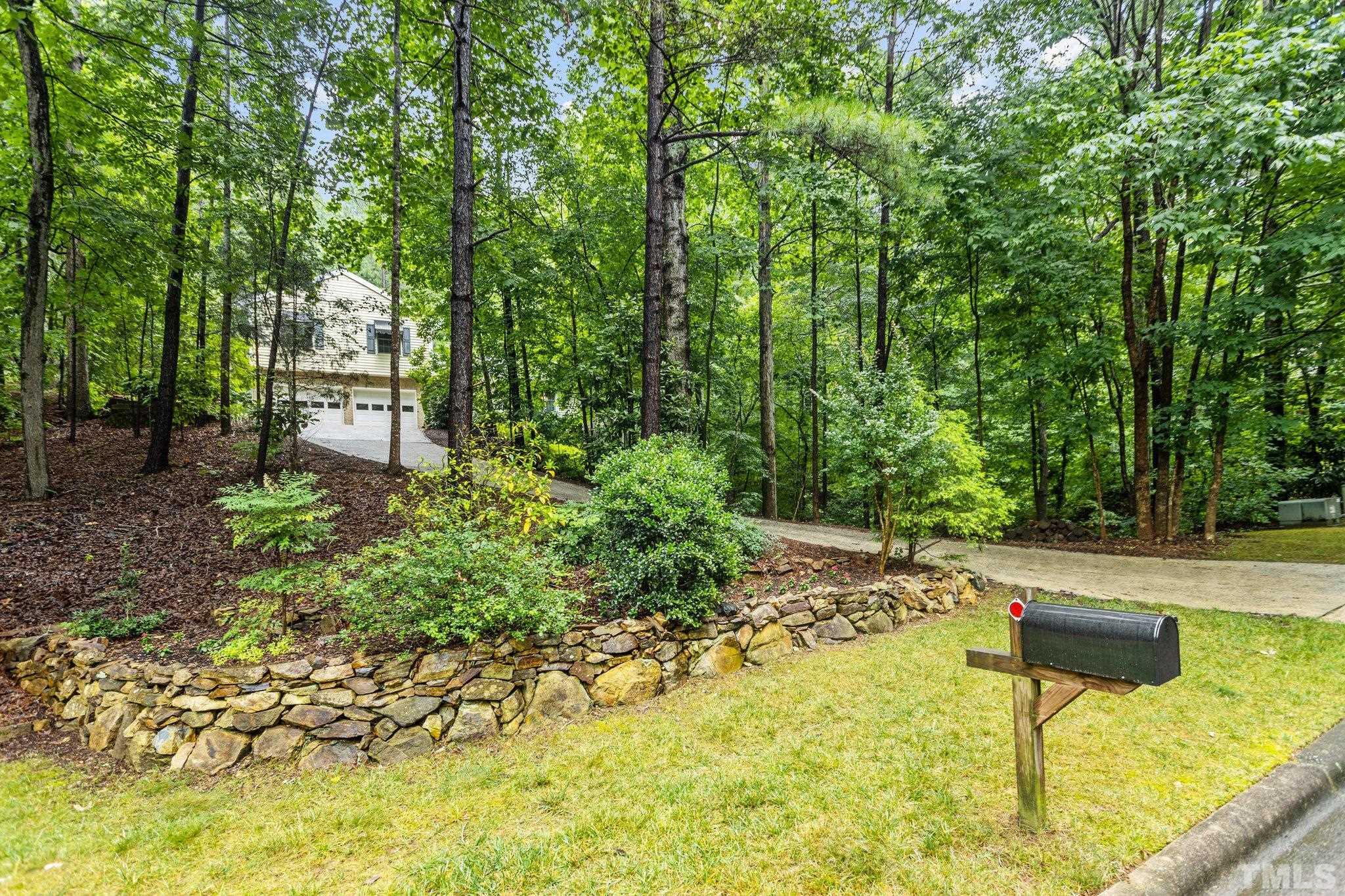 108 Rhododendron Court Chapel Hill, NC 27517 - Photo 31 of 38 a swimming pool with some trees and plants