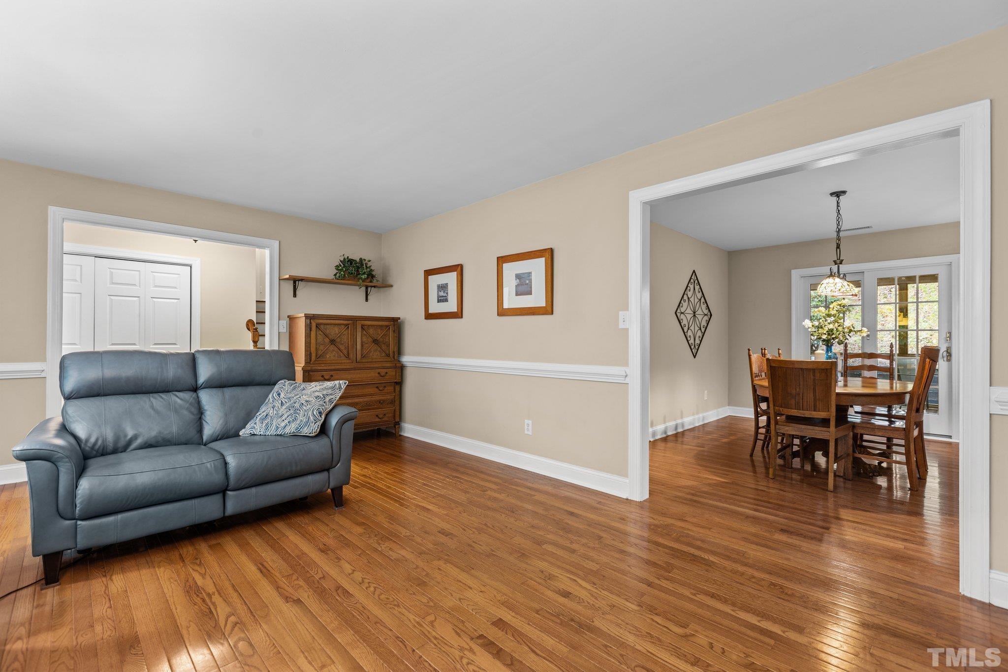 108 Rhododendron Court Chapel Hill, NC 27517 - Photo 7 of 38 a living room with furniture and a wooden floor