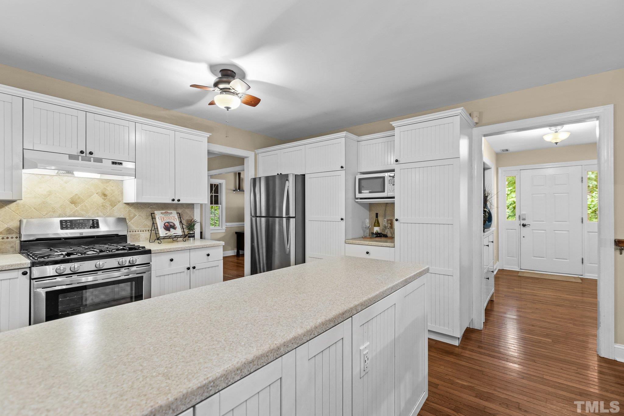 108 Rhododendron Court Chapel Hill, NC 27517 - Photo 9 of 38 a kitchen with stainless steel appliances a stove refrigerator sink and cabinets