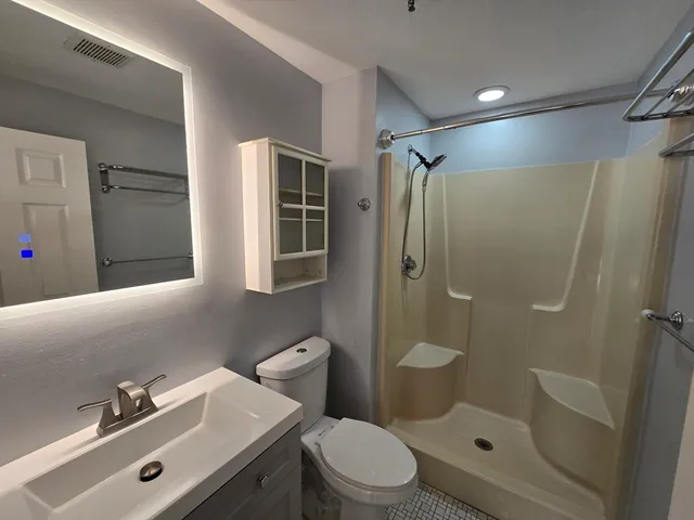 a bathroom with a sink and toilet
