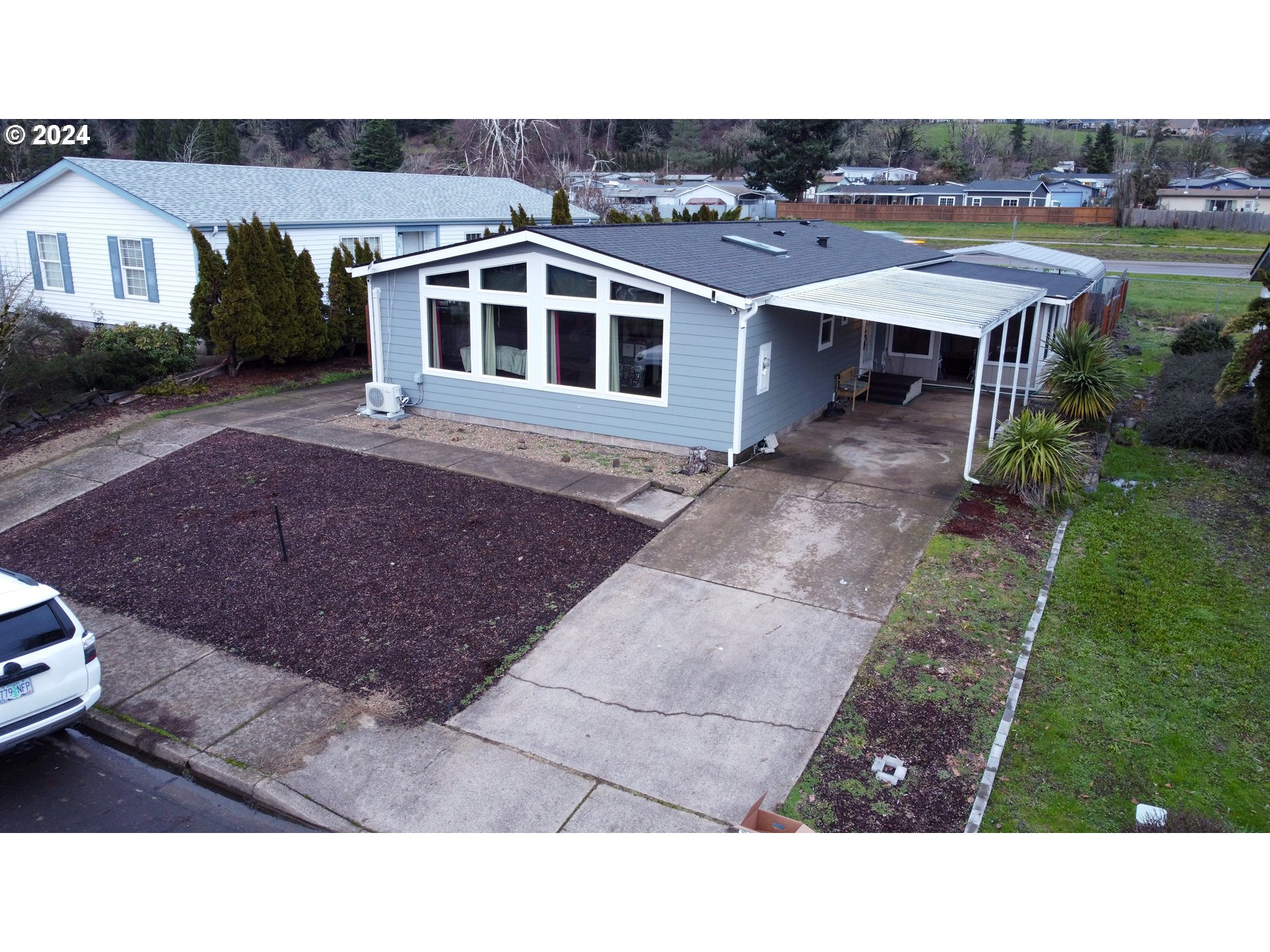 1251 South 58th Street Springfield, OR 97478 - Photo 1 of 24 a picture of a house with a yard