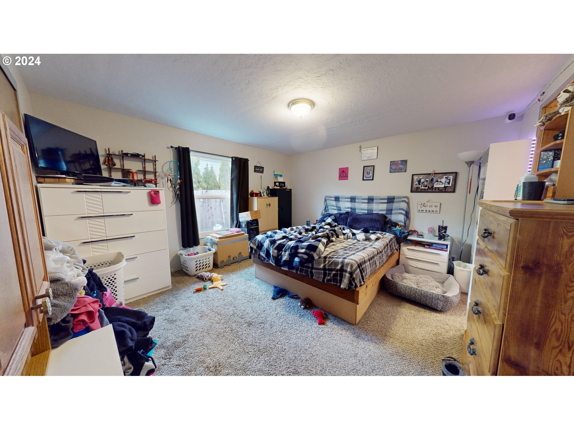 1251 South 58th Street Springfield, OR 97478 - Photo 20 of 24 a bedroom with furniture and a flat screen tv