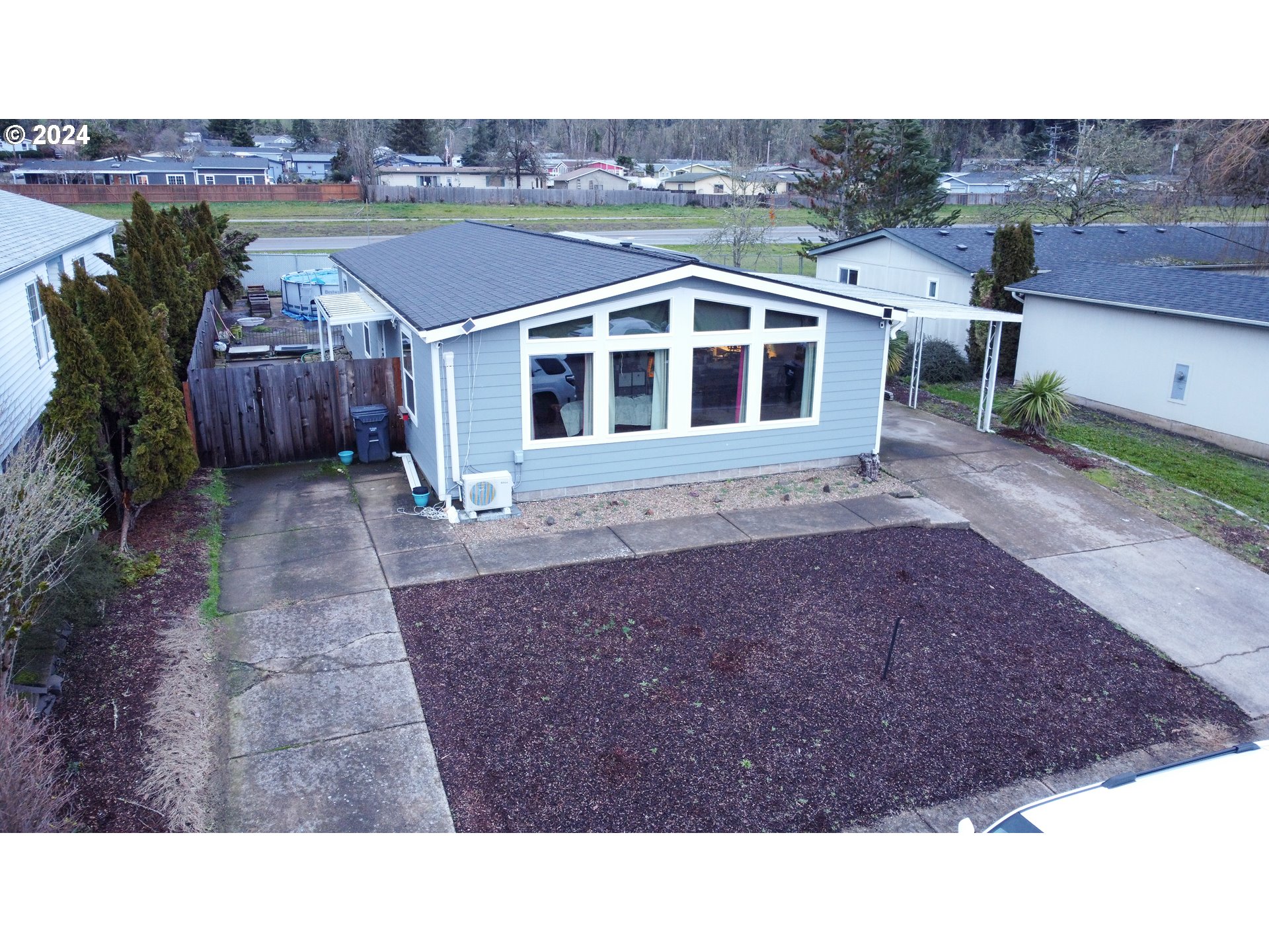 1251 South 58th Street Springfield, OR 97478 - Photo 5 of 24 a aerial view of a house with a yard