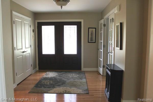 2965 Leyton Court Rochester, MI 48306 - Photo 2 of 29 Entry foyer with wood floors custom trim details