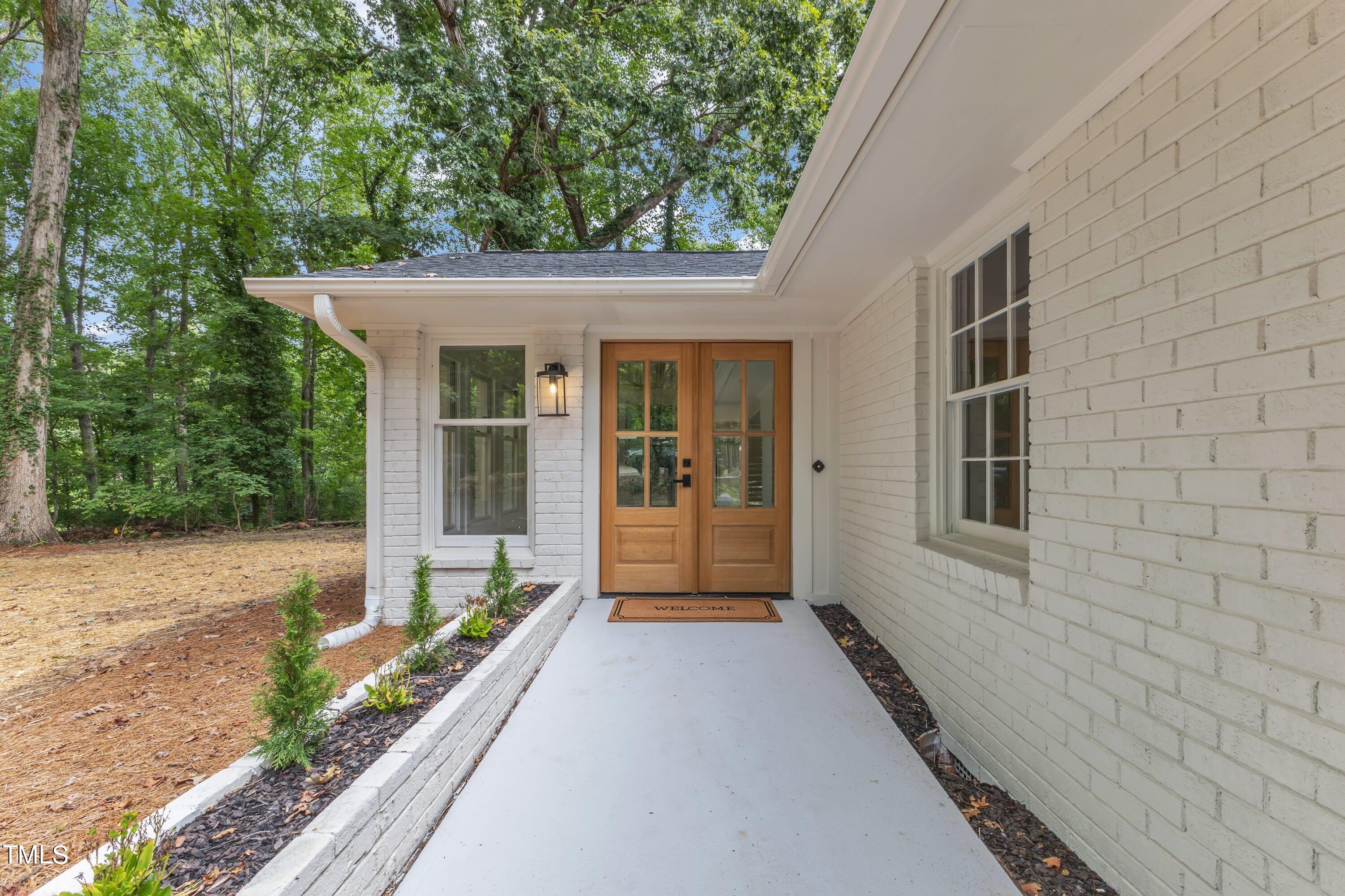 3023 Creech Road Garner, NC 27529 - Photo 2 of 42 a front view of a house with a porch