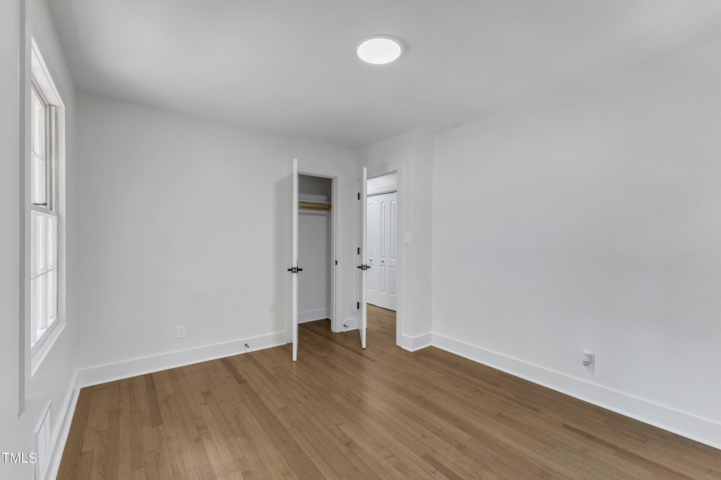 3023 Creech Road Garner, NC 27529 - Photo 28 of 42 a view of wooden floor and windows in a room