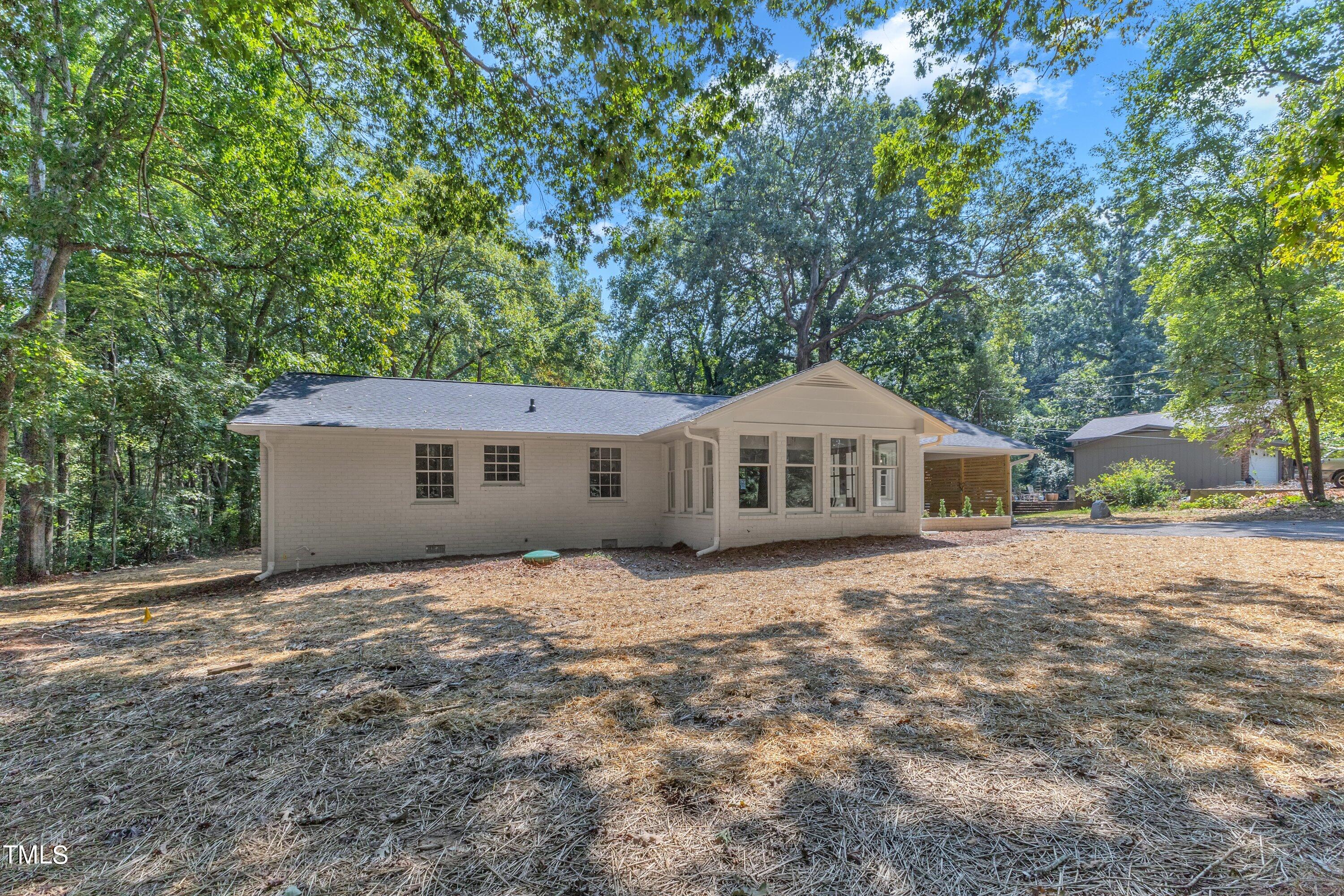 3023 Creech Road Garner, NC 27529 - Photo 39 of 42 a house with trees in the background