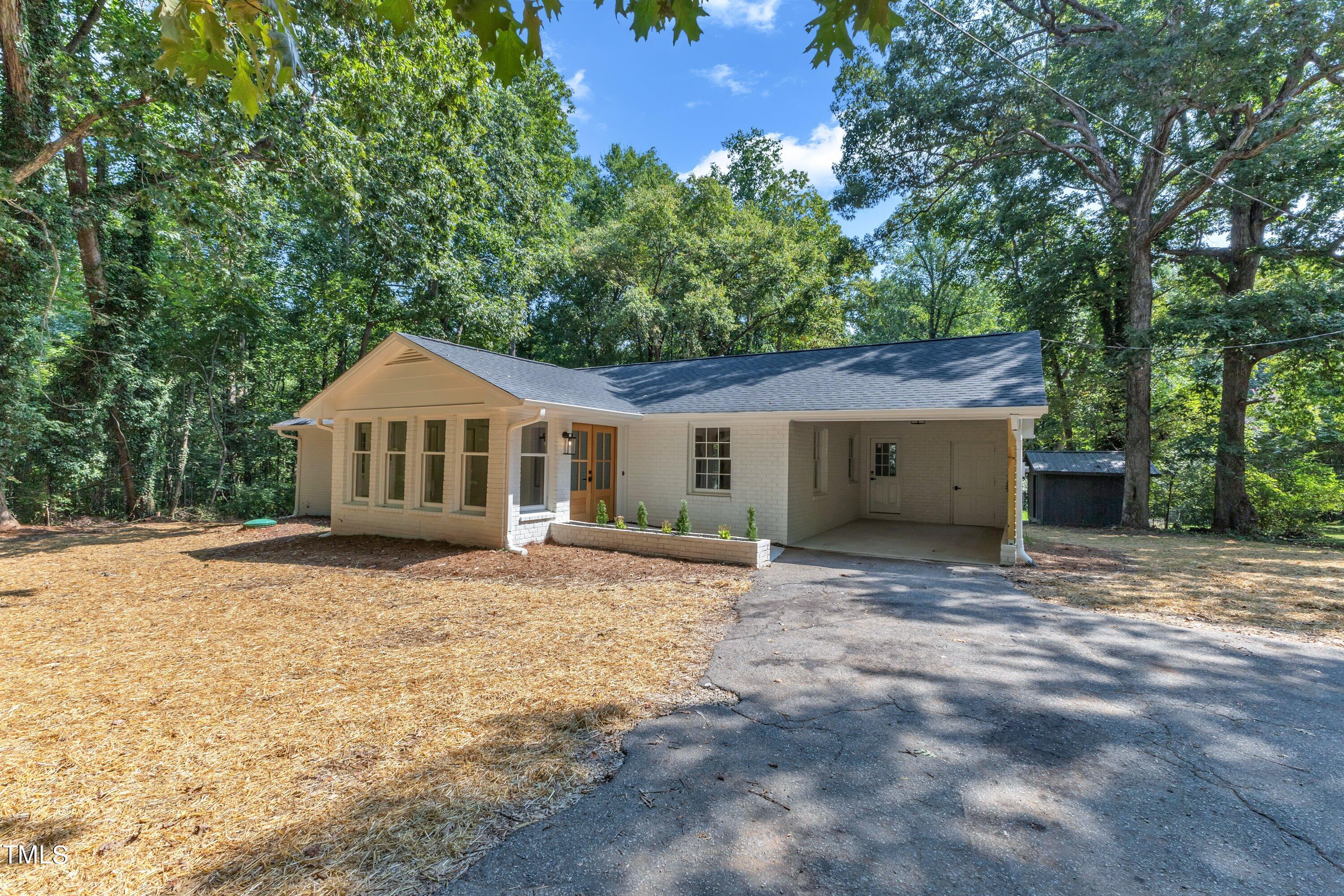 3023 Creech Road Garner, NC 27529 - Photo 40 of 42 a front view of a house with a yard