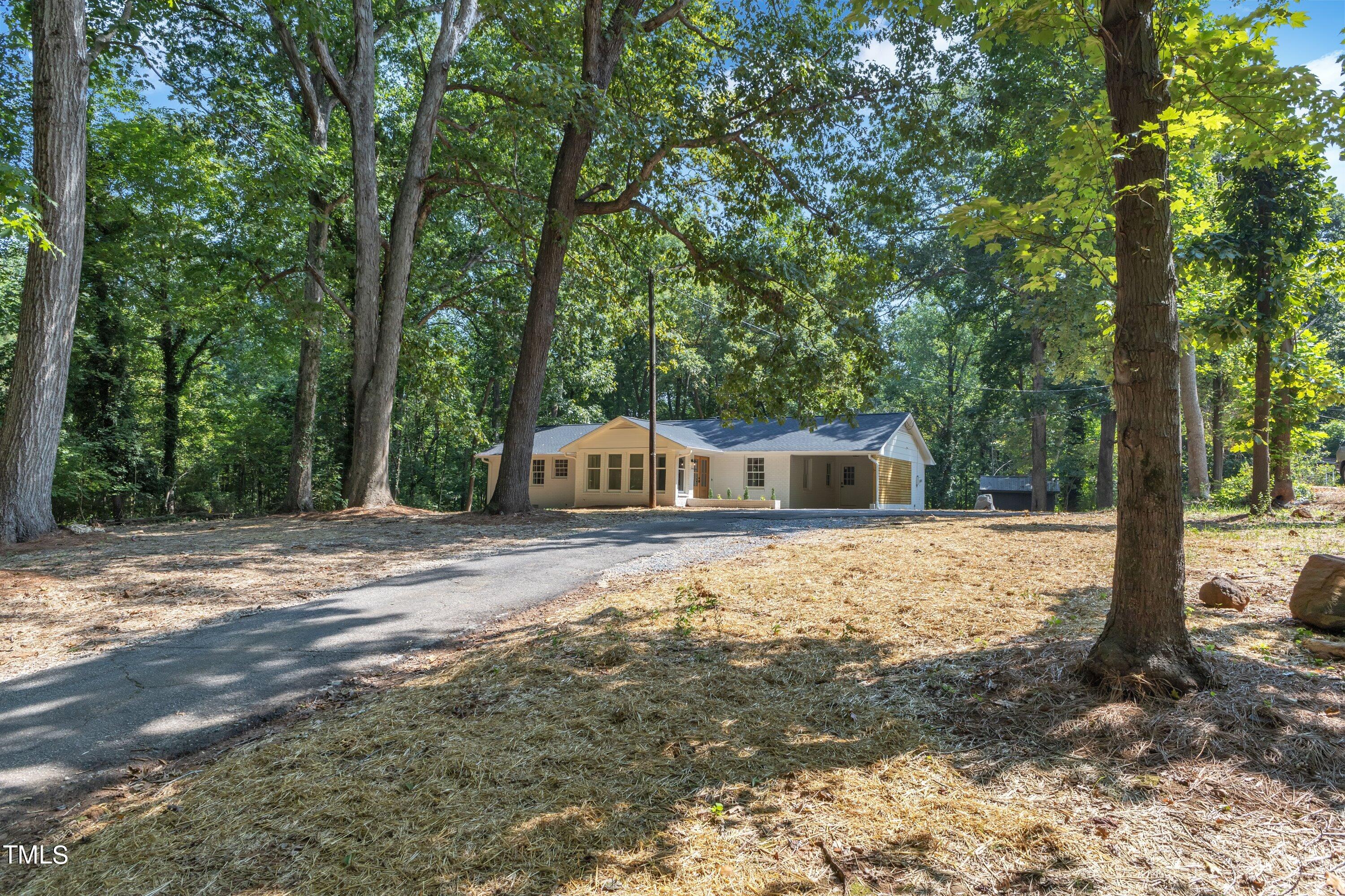 3023 Creech Road Garner, NC 27529 - Photo 41 of 42 a front view of a house with a yard and tree