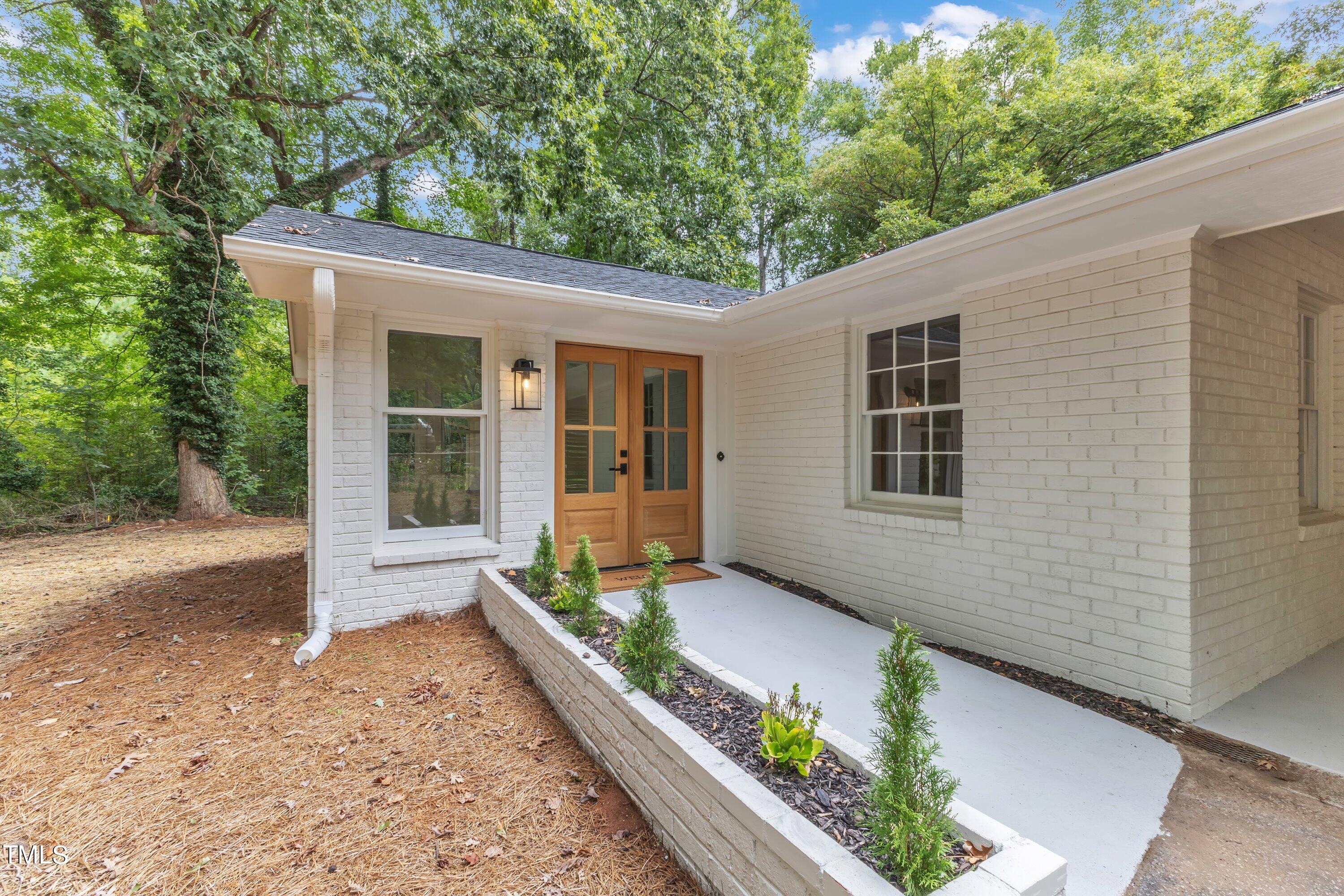 3023 Creech Road Garner, NC 27529 - Photo 5 of 42 a front view of a house with a yard