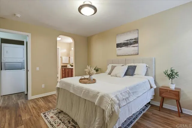 a bedroom with bed and a table