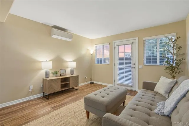 a living room with furniture and windows