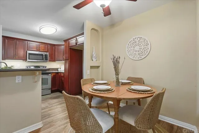 a kitchen with a dining table and chairs