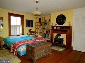 365 Tiger Valley Road Washington, VA 22747 - Photo 20 of 53 17' X 16' main bedroom with mantel & wood stove
