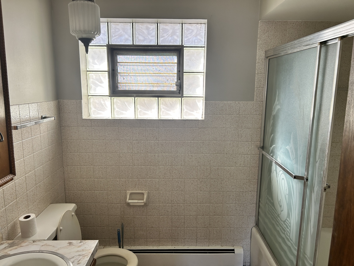 5645 West 63rd Place, Unit 2 Chicago, IL 60638 - Photo 11 of 13 a bathroom with a toilet sink and tub