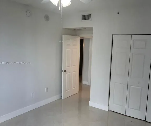 a view of an empty room with a fireplace