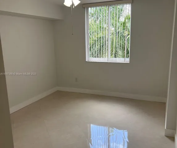 a spacious bathroom with a shower sink mirror and toilet