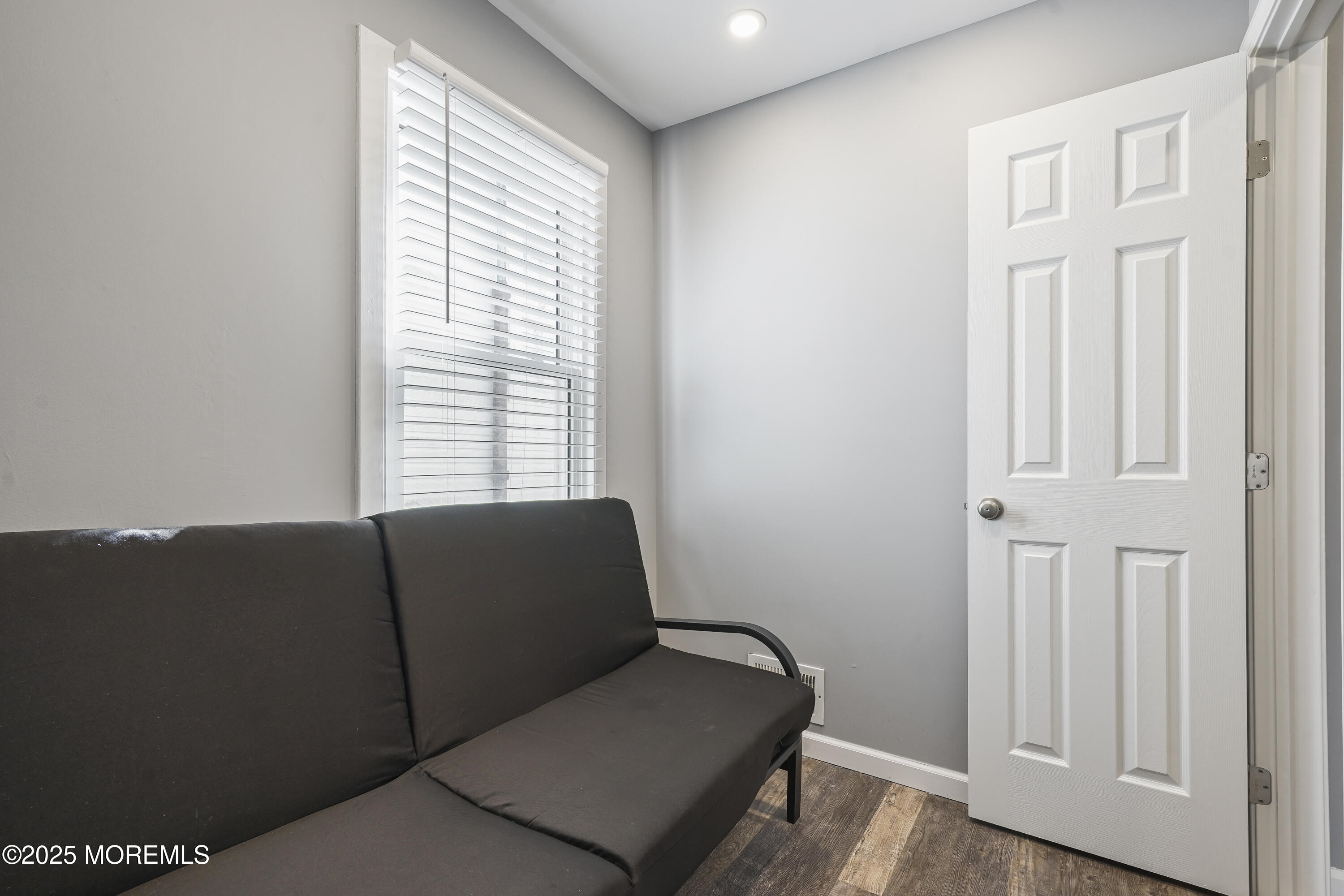 214 Webster Avenue, Unit 1 Seaside Heights, NJ 08751 - Photo 17 of 24 a living room with furniture and a window