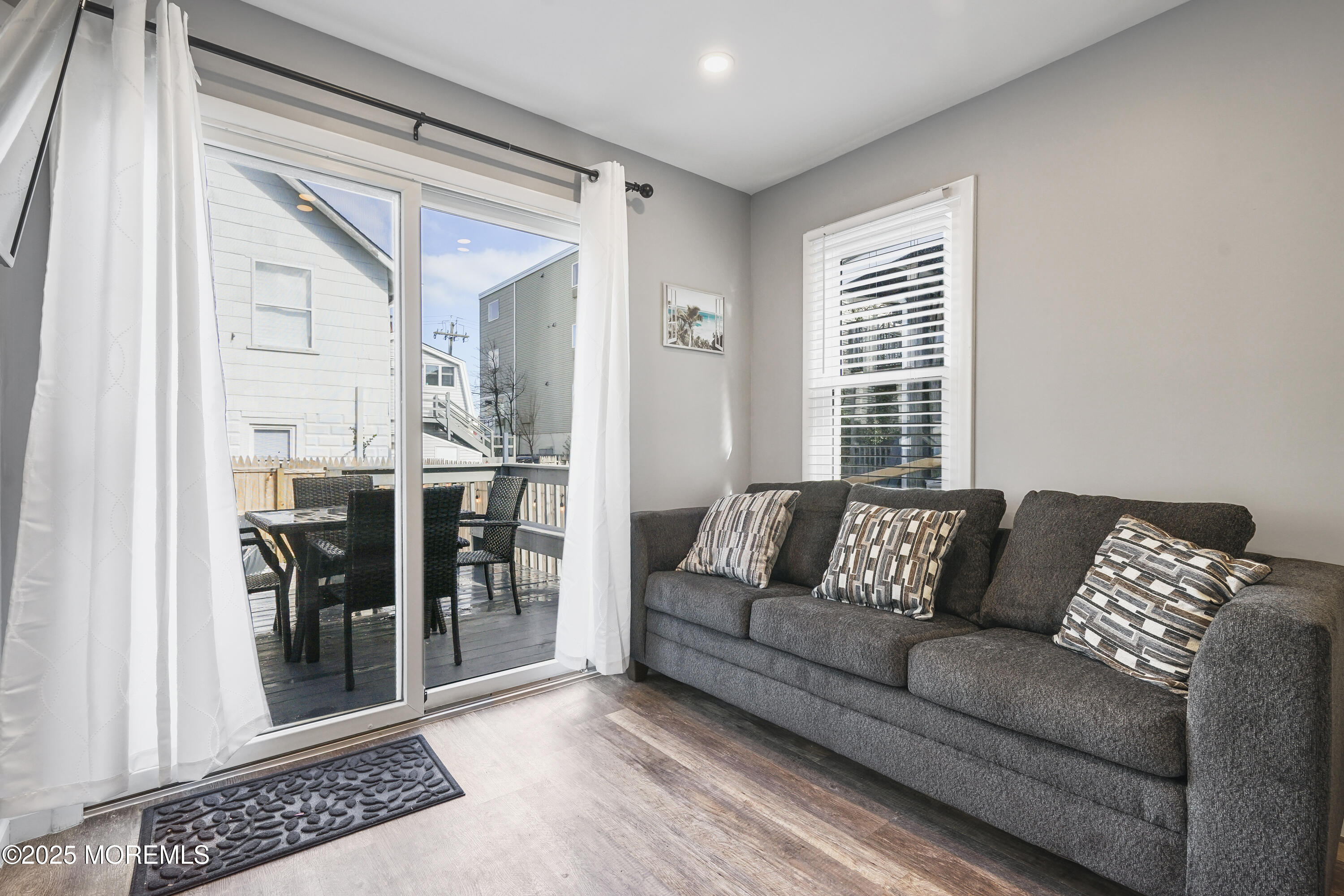 214 Webster Avenue, Unit 1 Seaside Heights, NJ 08751 - Photo 18 of 24 a living room with furniture and a window