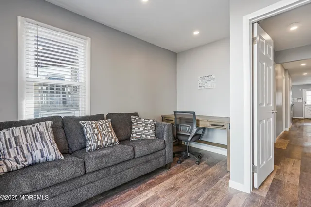 a living room with furniture and a table