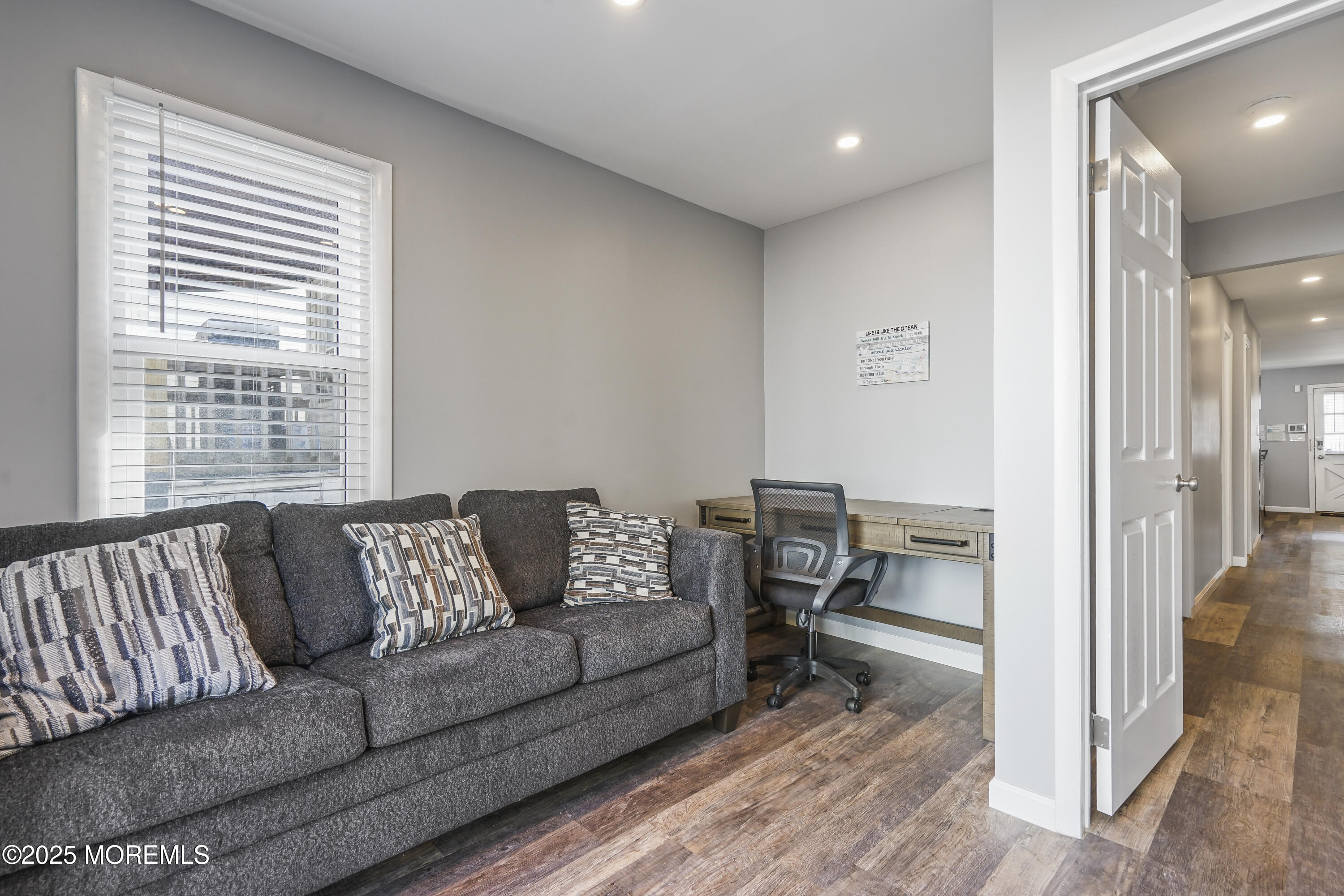214 Webster Avenue, Unit 1 Seaside Heights, NJ 08751 - Photo 19 of 24 a living room with furniture and a table