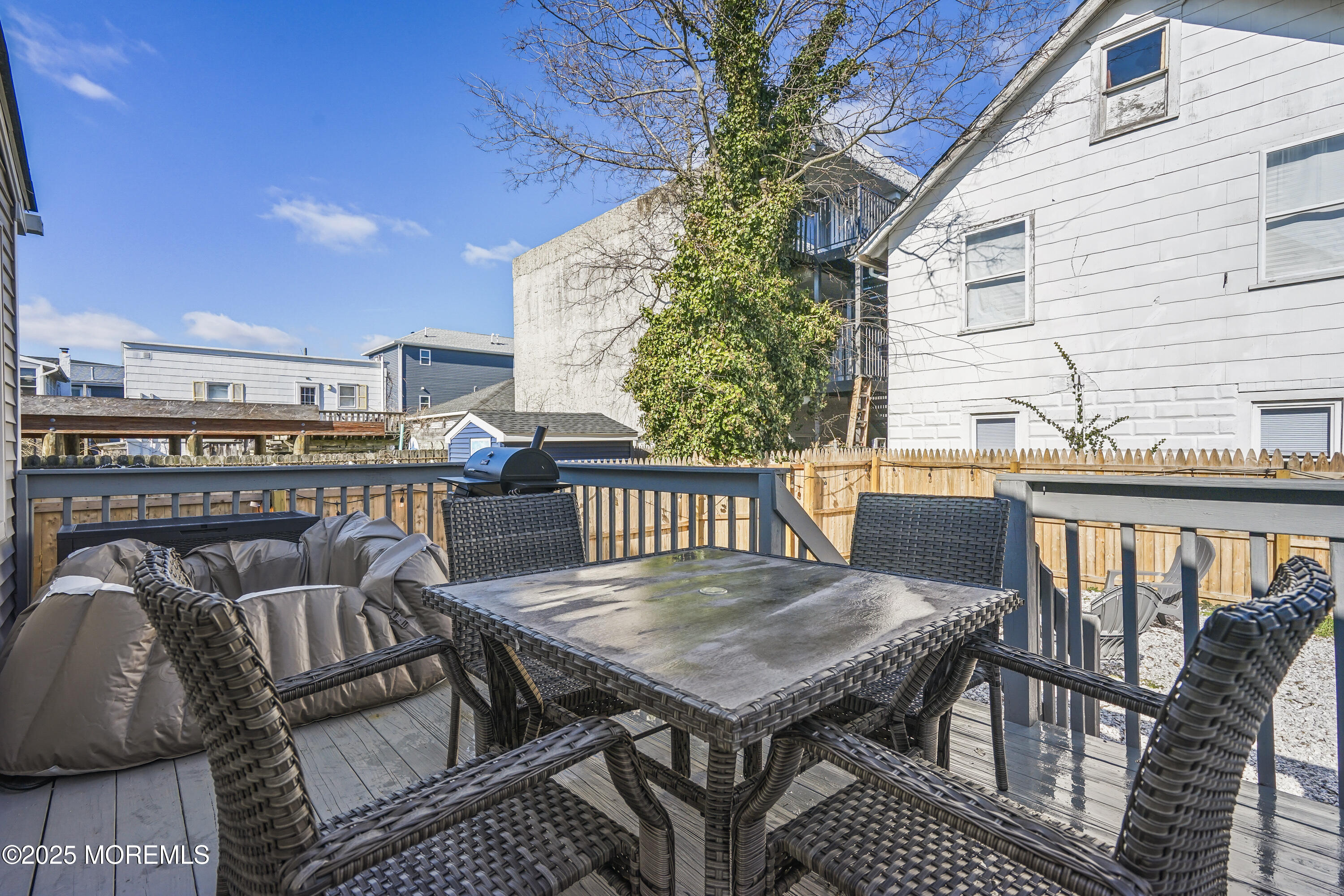 214 Webster Avenue, Unit 1 Seaside Heights, NJ 08751 - Photo 22 of 24 a balcony with table and chairs