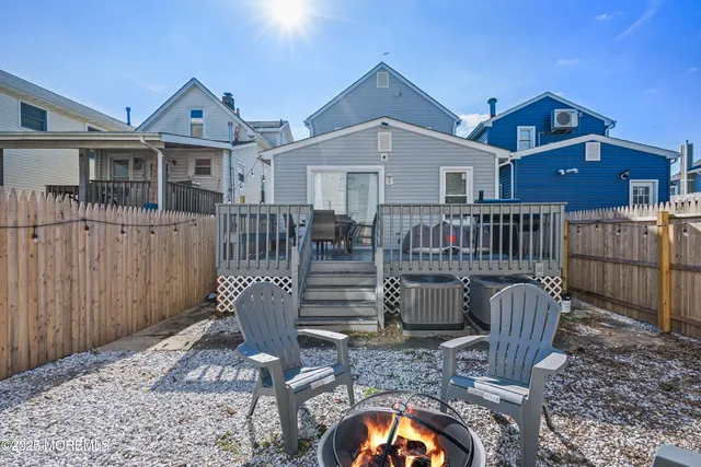 a view of a patio with a table and chairs