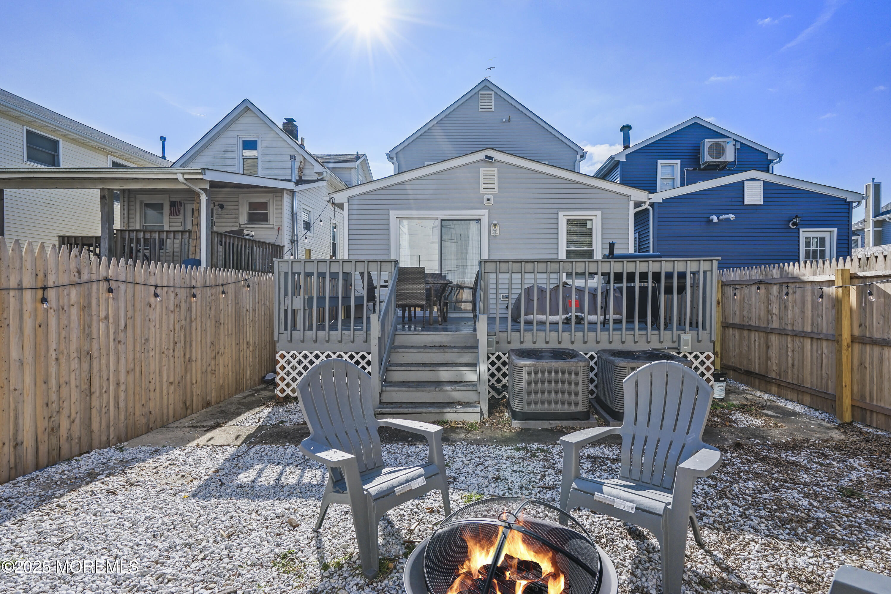 214 Webster Avenue, Unit 1 Seaside Heights, NJ 08751 - Photo 24 of 24 a view of a patio with a table and chairs