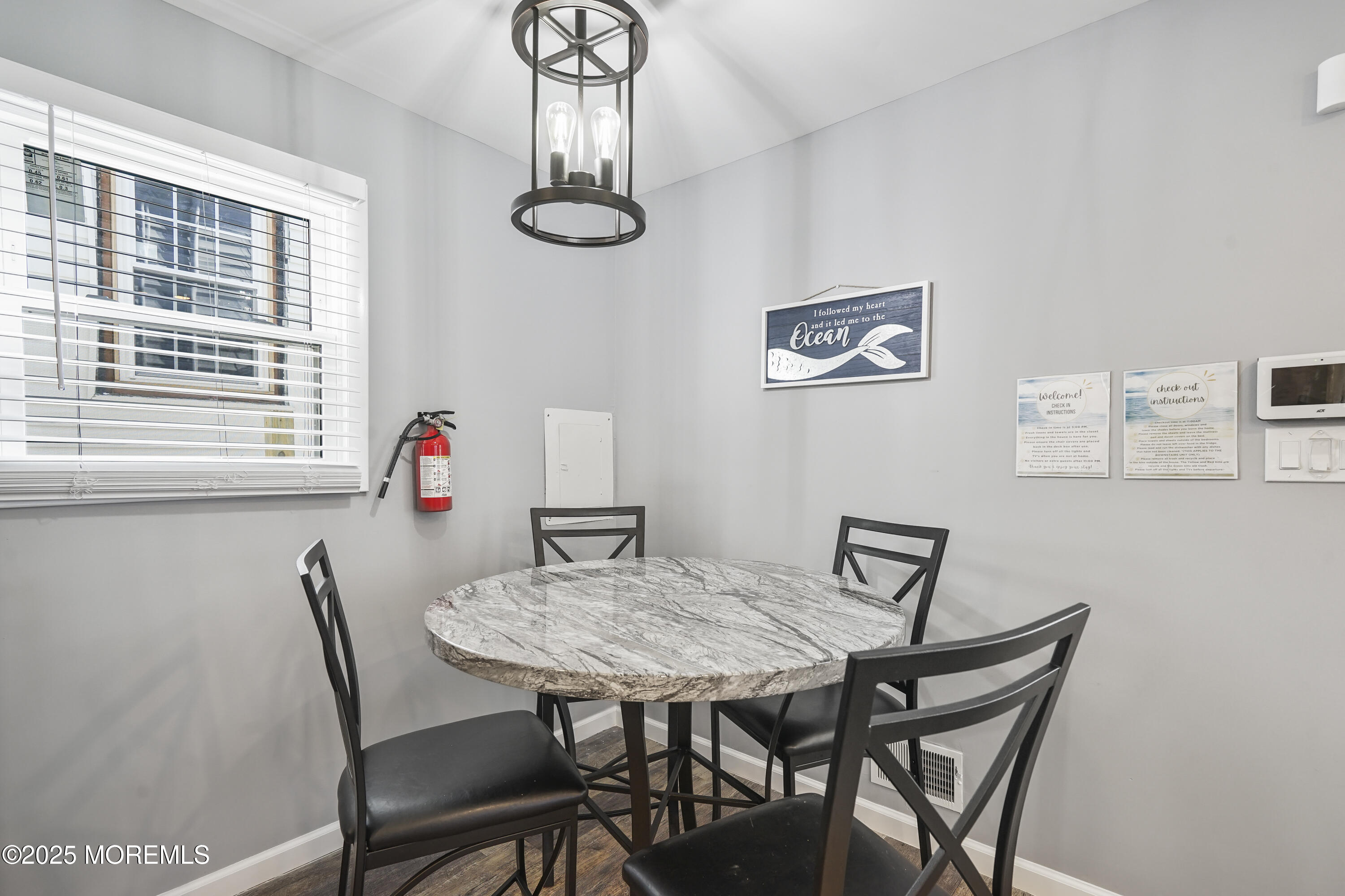 214 Webster Avenue, Unit 1 Seaside Heights, NJ 08751 - Photo 9 of 24 a view of a dining room with furniture and a window