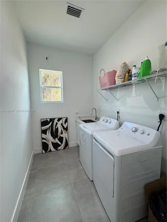 a utility room with dryer and washer
