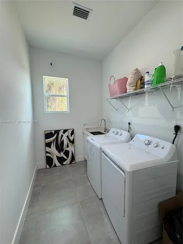 a utility room with dryer and washer