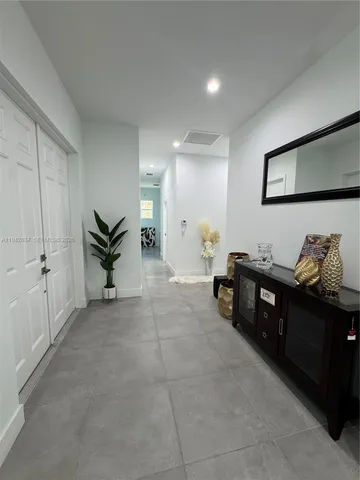 a room with a bed and furniture