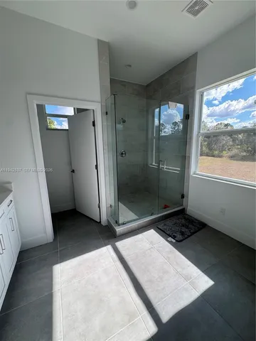 a view of an empty room and window