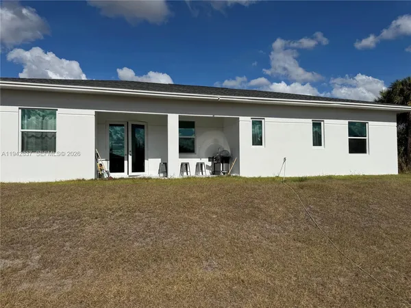 front view of a house with a yard
