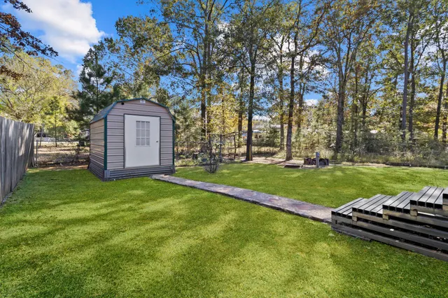 an aerial view of a house with a lake view