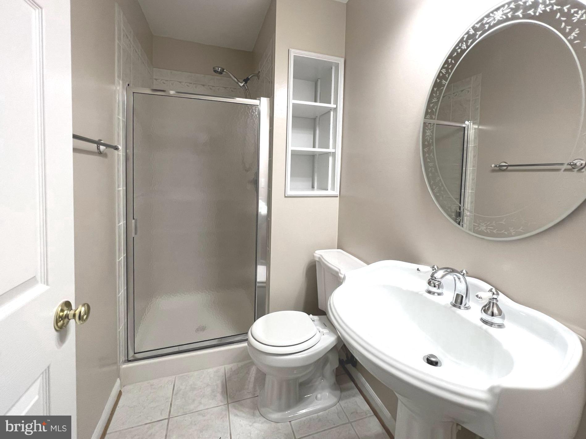 2610 Streamview Drive Odenton, MD 21113 - Photo 18 of 23 a bathroom with a sink toilet and shower