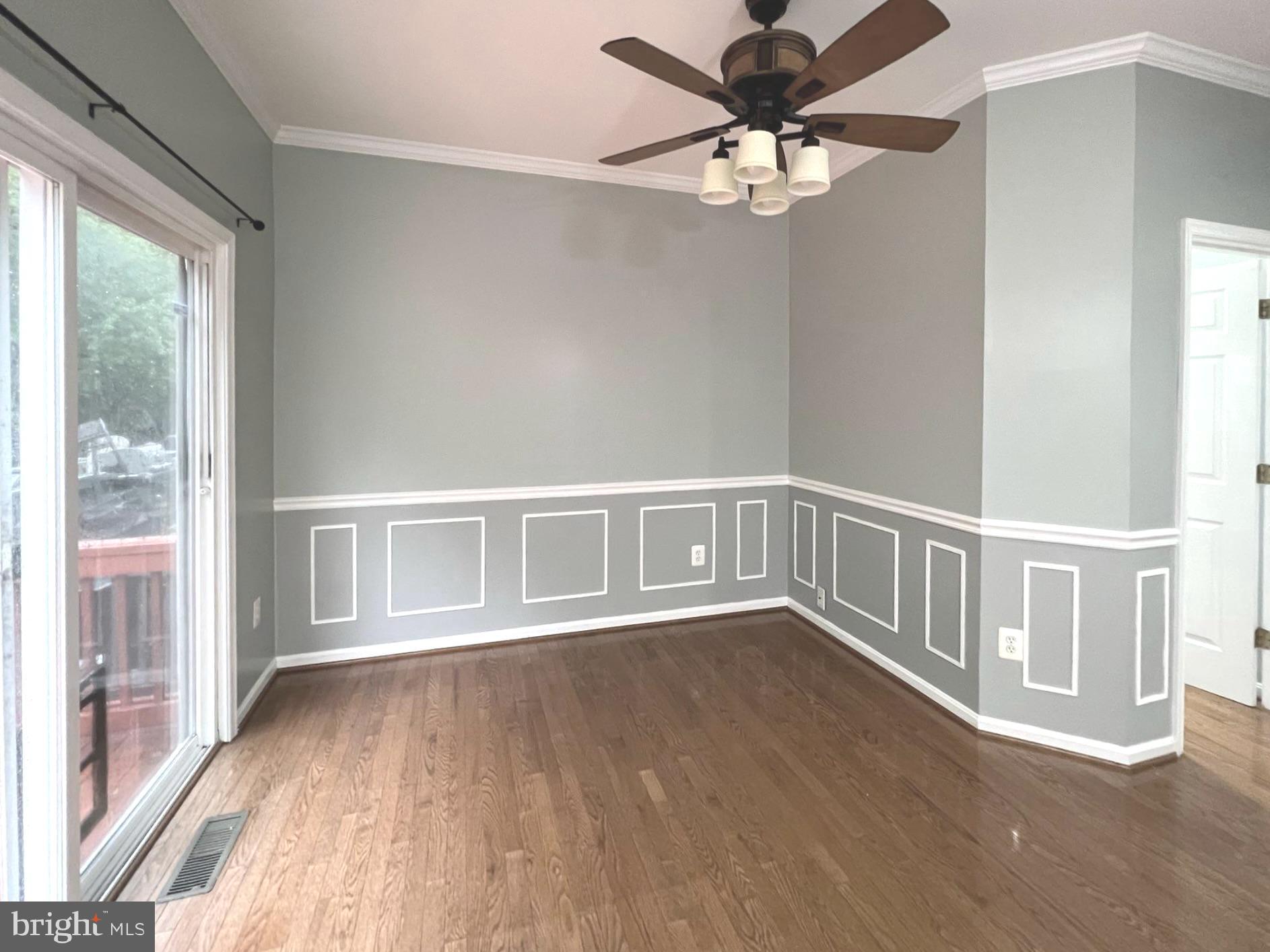 2610 Streamview Drive Odenton, MD 21113 - Photo 7 of 23 a view of an empty room with wooden floor and a window