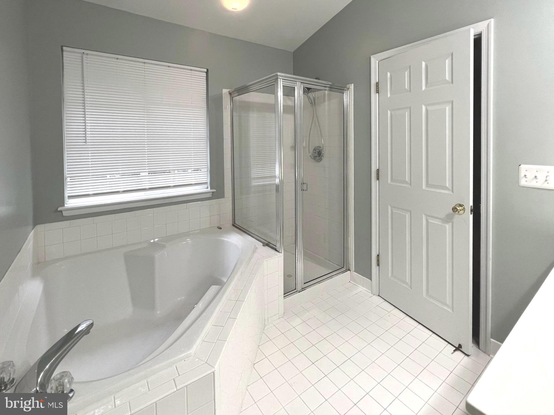 2610 Streamview Drive Odenton, MD 21113 - Photo 10 of 23 a bathroom with a bathtub and a shower