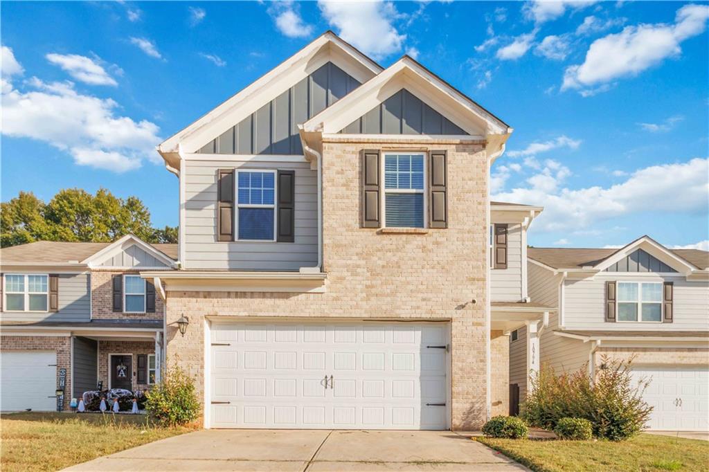 a front view of a house with yard