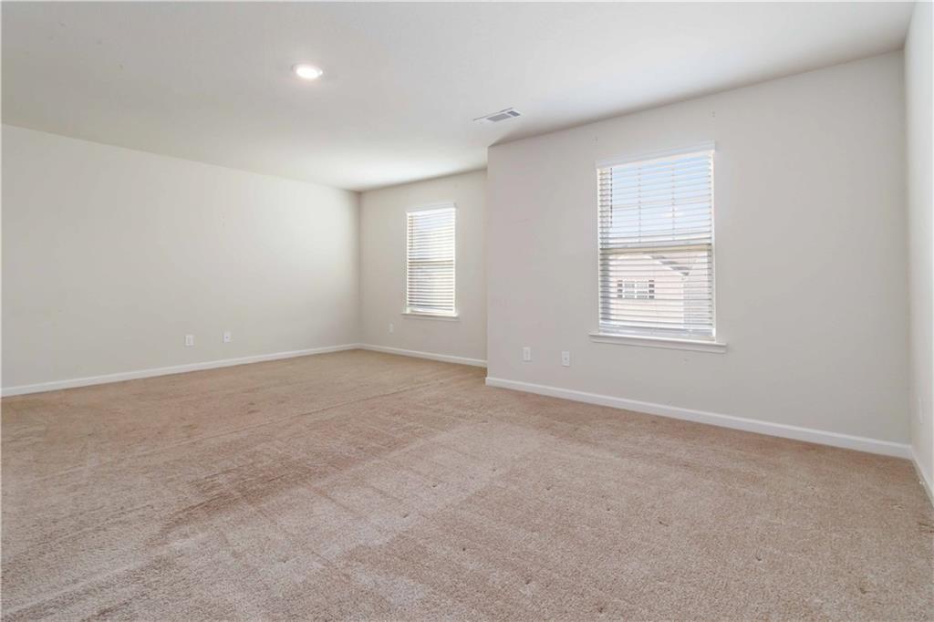 10794 Wheeler Trace Hampton, GA 30228 - Photo 19 of 35 an empty room with windows