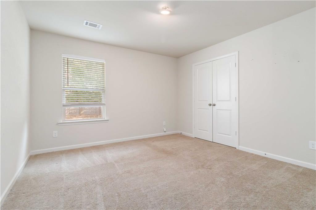 10794 Wheeler Trace Hampton, GA 30228 - Photo 24 of 35 a view of an empty room with a window
