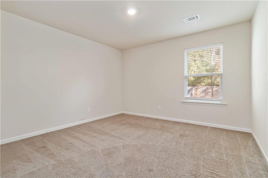 10794 Wheeler Trace Hampton, GA 30228 - Photo 26 of 35 an empty room with windows
