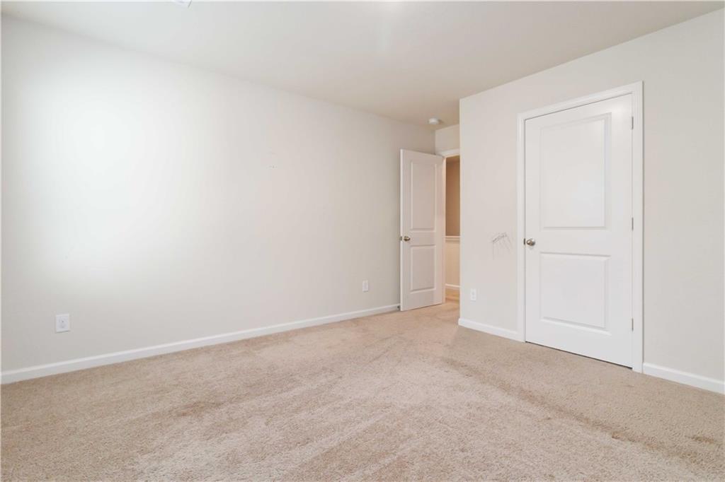 10794 Wheeler Trace Hampton, GA 30228 - Photo 27 of 35 a view of an empty room