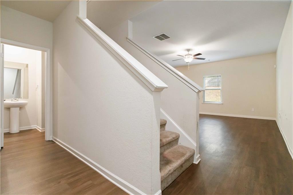10794 Wheeler Trace Hampton, GA 30228 - Photo 6 of 35 a view of entryway and hall with wooden floor