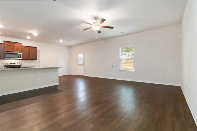 a view of kitchen with sink and wooden floor