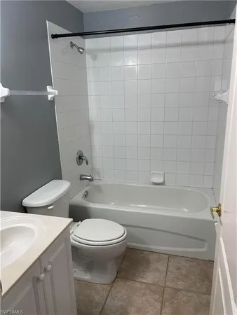 a bathroom with a toilet and a bathtub