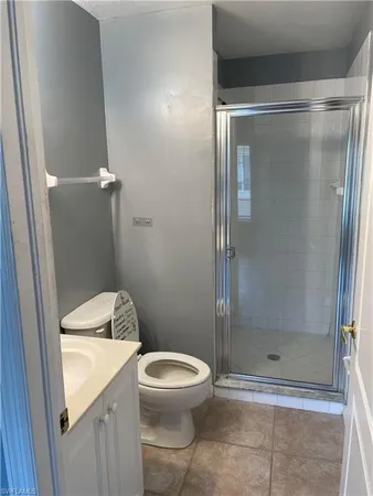a bathroom with a shower and a toilet