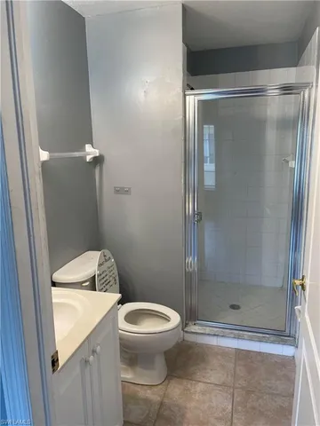 a bathroom with a shower and a toilet