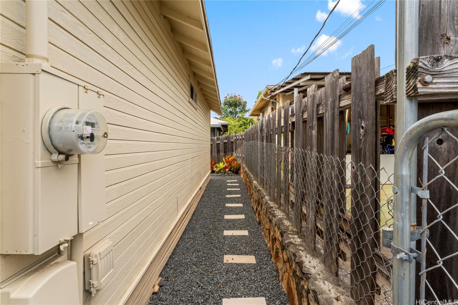 1506 Frear Street, Unit A Honolulu, HI 96813 - Photo 21 of 25 Clean and maintained side walkway showing the detached nature of the home.